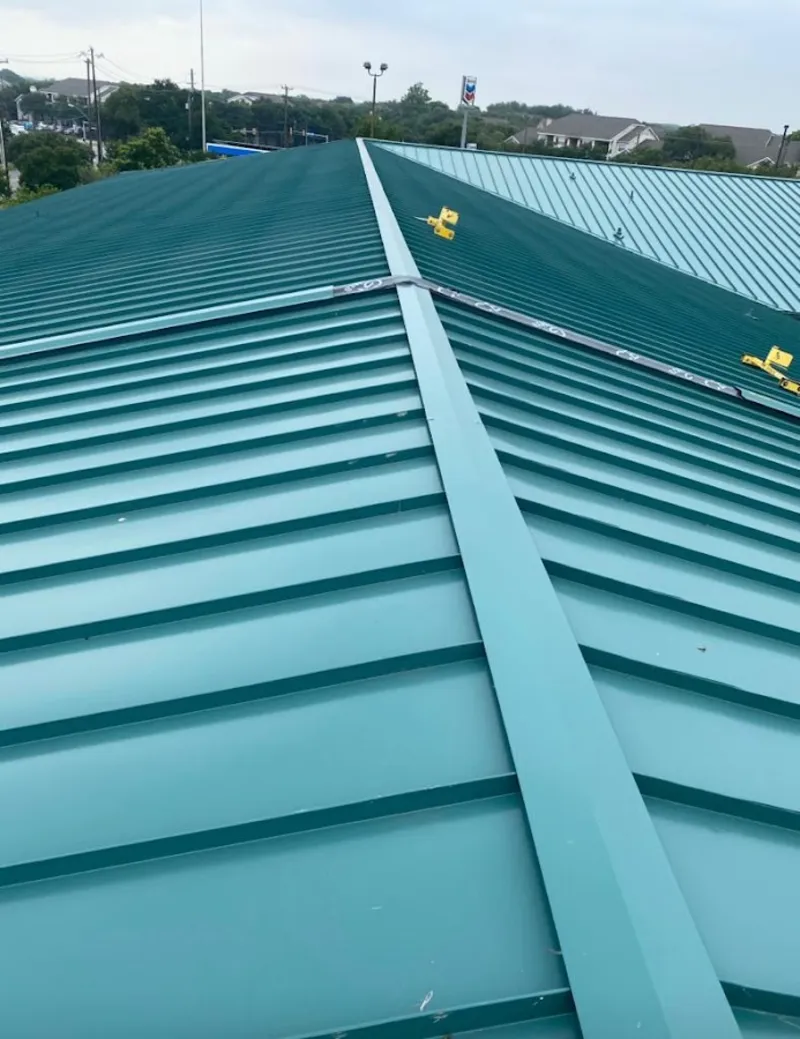Green commercial metal roof ridge and valley for Metal Roof Repair in Belmont